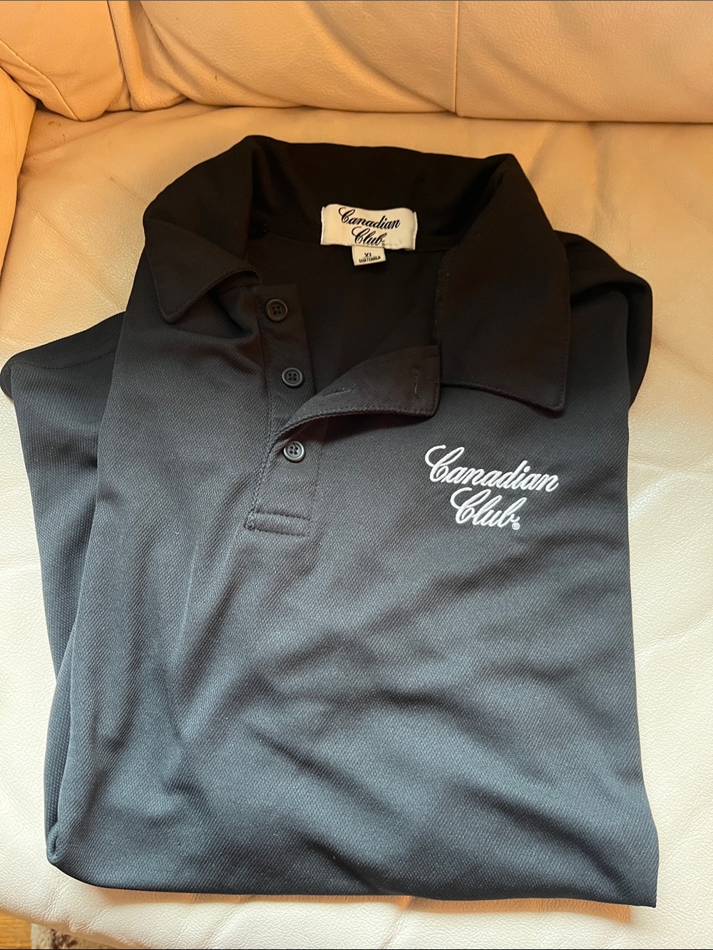 Black men’s polo with Canadian Club logo